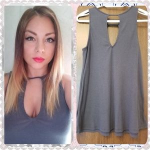 Grey low cut flowy top.